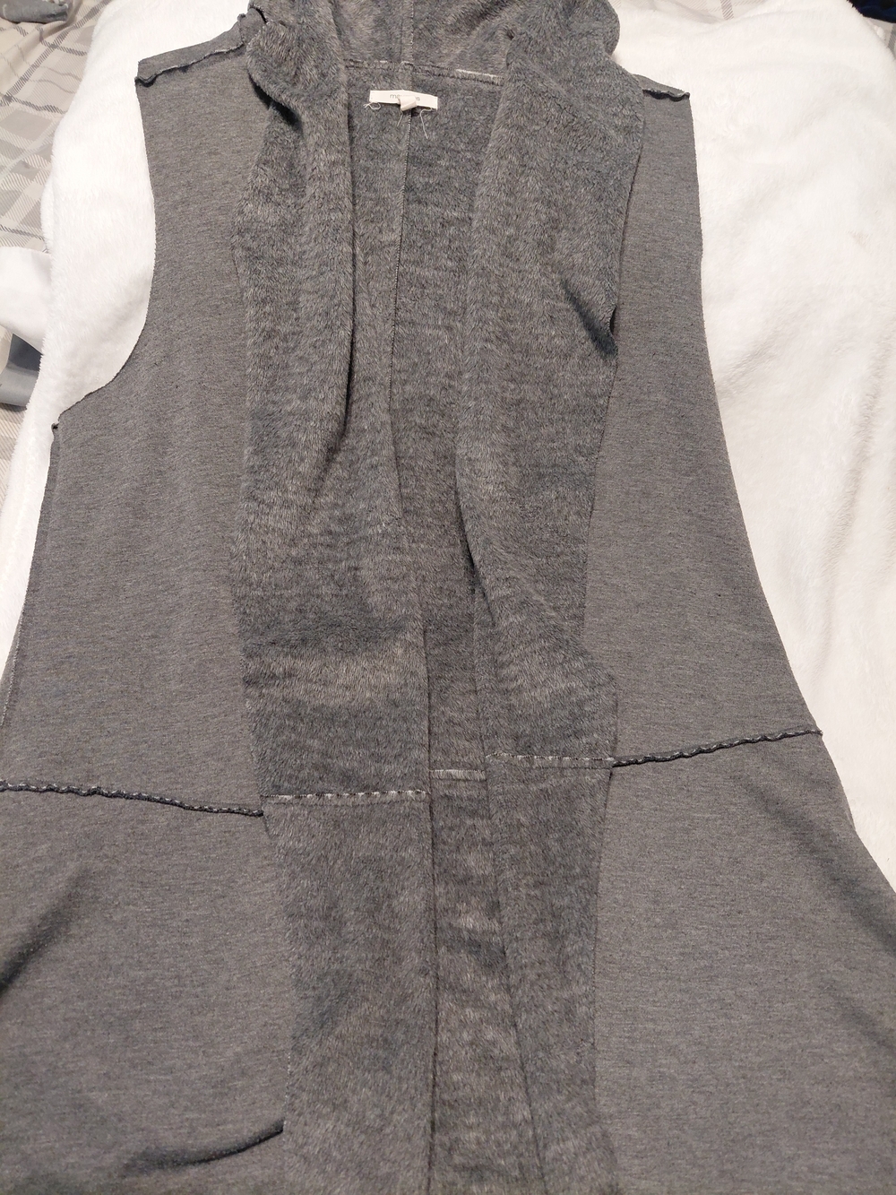 Women's grey fuzzy coat interior with label